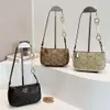 De winkel exporteert designer tassen groothandel high -end kleine vierkante tas voor dames 2024 Nieuwe vintage single schouder crossbody met modieus gedrukt