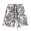 Sommarmode, europeiska och amerikanska modemärken, forntida hemstil, familjestil, unisex blommor tryckta avslappnade strandshorts för män och kvinnor