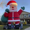 10m 32,8 pés de altura Jogos ao ar livre gigantes decoração engraçada inflável Papai Noel pai de Natal soprado com bolsa na mão para festa de festival