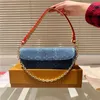 24SS Femme de luxe pour femmes NOUVEAU PAPILLE DE COURTURE COWDE SUR LA CHACHNE IVY DENIM SAG SAVAGE SALLE FEMMES Sac à main Sac Sac Chain