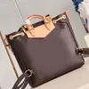 Designer Backpack Style Echte lederen merk Girl Bags Excursie kleine bakken luxe kwaliteit dames handtassen 21cm kettingzakken