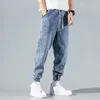 Mäns jeansbyxor last Blue Man Cowboy Pants beskurna sommaren 2024 mode mjuk koreansk höst i denim baggy trend