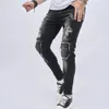 Jeans da motociclista da uomo Jeans strappati strappati Jeans a matita skinny da moto Pantaloni da uomo Pantaloni alla moda in denim casual con fori maschili 240322