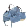 Källa High 2024 Spring New Nylon Bag Waterproof Commuter Dumpling Large Medium och Liten Shoulder SS03095