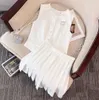 24-dames set designer rok Set mode brief borduren mouwloos shirt pak luxe effen kleur hoge taille geplooide rokken tweedelig