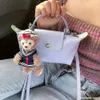 Sac à bandoulière pour femmes, boutique, bon marché, exportation, nouvelle mode printemps/été, Mini main, petit et populaire boulette, téléphone zéro portefeuille, 2024