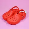 Croc sandalen beroemde ontwerper Dames Mannen Kinderen Clog slides slippers klompen strand waterdichte schoenen gesp