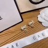 Luksusowe kolczyki pozłacane i srebrne zaprojektowane przez projektanta marki o kształcie łuku specjalnie zaprojektowanym dla uroczych dziewcząt romantyczne miłosne pudełka ślubne