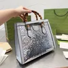 Luxe vrouwen tote handtas ontwerper klassieke bamboe handvat flash decoratie tassen vrouwen grote capaciteit winkelen handtassen modieuze glanzende portemonnee