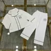 Popular bebé Pijamas diseñador ropa para niños niña niño ropa de dormir Tamaño 100-160 abrigo para dormir para niños Camisa de manga larga y pantalones de cintura elástica 24Mar