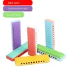 Armonica a 10 fori Giocattoli per bambini Strumenti educativi precoci Colori caramelle