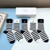 Men's stockings sports socks sports socks Joker solid color classic hook ankle breathable black and white basketball football garter box.