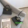 Ky Tote Bags Sac à main en cuir de luxe de confiance 2024 Nouveau sac femme Mini deuxième génération Mini petit sac en cuir véritable première génération français ont le logo HBKW