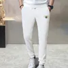 Pantaloni di abbigliamento firmati Primavera Estate Nuovi pantaloni sportivi in cotone stampato da uomo Pantaloni sanitari larghi casual in materiale spugna da donna