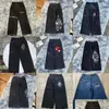 メンズジーンズのデザイナーJNCO Y2Kストリートウェアファッションヒップホップボクシンググローブグラフィックプリントバギーブラックパンツ男性