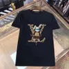 Yeni Erkek Tişört Asya Boyut M-5XL Erkekler Tasarımcı T-Shirt Sıradan MMS T-Shirt Baskılı Alfabe Kısa Kollu Üst Lüks Hip Hop Giysileri Erkek ve Kadın T-Shirt