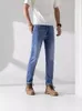 Designer 2023 Spring New Men's Blue Jeans Classico logo timbro in acciaio Leggings Elastici Pantaloni lunghi casual Lavato uomo Pantaloni dritti azzurri