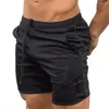 Shorts pour hommes Hommes Side Slit Fitness à séchage rapide avec poches de taille élastiques Streetwear Lettre Imprimer pour actif