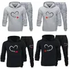 Herrspår och kvinnors tryckta par sportkläder "Jag är med hennes" Hooded Shirt Pants Two-Piece Set Pvd Hoodie Smiling Lover