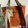 Emmer Tas Designer 50% Korting op Hot Selling Merk Damestassen Nylon Draagtas Canvas Kleine Nieuwe Kleur Handtas Schattig Casual Dames