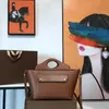 Luxury New Womens handväska har en delikat tygpåse gjord av italiensk kalvläder Den löstagbara axelremmen med flera fickor är utformad storlek 23*13*26 cm