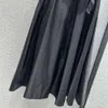 Spódnice dla kobiet projektantka mody midi czarna moda highwaist z muszką i zamkiem w talii wersja A-line SML FZ0306140 DROP DEVIV OTUAQ