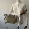 Les sacs à main de haute qualité de source d'usine sont le nouveau sac de boulette en cuir véritable de style étoile 2024 avec une couche supérieure de grande capacité en cuir de vachette à bandoulière minimaliste urbain