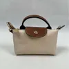 Shop crossbody bolsa de exportação barata mini bolinho de massa versátil para mulheres diárias de mão com alças perfuradas hol e ombro