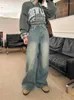 Damskie spodnie retro z szerokim nogi dżinsy dla kobiet we wczesnej wiosny w stylu z szorstkimi krawędzią i luźnym pasmowym zużyciem
