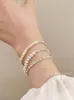 Bracciale di alta moda Bracciale in argento rotto, perla femminile, bracciale barocco in argento puro, lusso leggero e perline semplici, nuova moda di fascia alta 2024