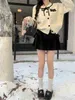 Designer Kvinnors tröja Autumn/Winter New Button Bow Sweater Cardigan Off White Sweet Stacke Jacket Liten Short Underlag