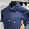 メンズカジュアルシャツのトップグレードのコットンショートスリーブシャツ2024到着夏のファッションポケット青年男性のブランド服