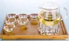 Ensembles de thé 1x 9 en 1, ensemble de thé à café-485ml, théière à fleurs en verre résistant à la chaleur, chauffe-Pot en cristal, 6 tasses à Double paroi, plateau en bambou