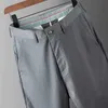 Mäns byxor Ny vår/sommarmens mjuk elastiska tyg affärsuppsättning Mens elastiska midja rakt arbete kostym grå byxor J240328