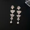 Charme incrusté de strass arc perle boucles d'oreilles pour femmes 2024 nouvelle mode luxe boucles d'oreilles personnalité étincelle unique bijoux de mariage Y240328