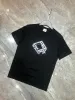 Hommes Designer T-shirt de luxe lettre noire mode imprimé t-shirts à manches courtes marque de mode 100% coton hommes femmes T-shirt