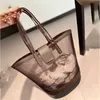 Designer Beach Tote Mesh Bolsa de ombro Mulheres Moda Bolsa de compras Carta impressa Bolsa de ombro transparente Praia Bolsa portátil 240329