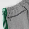 Męskie spodnie mężczyźni kobiety 1: 1 w paski haftowe igły motylki ścieżki Awge Spodnie szare zielone taśma