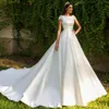 .Nueva inclusión Vestidos de novia de manga corta Apliques de cuentas Ilusión Volver Francia Vestidos de novia de satén Vestidos De Boda