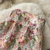 Lässige Kleider Frühling und Sommer böhmischer Resort-Stil Blumenbüste hohe Taille Paket Hüfte offenes Chiffon-Kleid