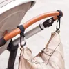 Parti del passeggino Accessori per ganci per bambini Sedia a rotelle multiuso Carrello per auto in metallo Borsa per la spesa Clip per carrozzina Passeggino sospeso