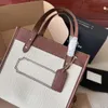 2024 Bolsa de designer nova moda de grande capacidade Bolsa de ombro de lona Crossbody Bag feminina bolsa mamãe bolsa de viagem curta bolsa de compras