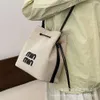 Tiendas Exportación Bolsos de hombro de diseñador Bolso tipo cubo popular de este año para mujeres en 2024 Nuevo bolso de lona Bolso cruzado versátil y de alta gama coreano