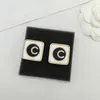 2023 Boucle d'oreille de charme de qualité de luxe avec collier pendentif design de couleur noir et blanc avec timbre de boîte PS7587A243r