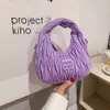 店舗輸出デザイナーショルダーバッグ女性のための小さなデザインバッグ2024新しいフォールドハンドヘルドミニ汎用性のあるワンショルダークロスボディ
