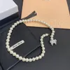 MUI MUI Naszyjnik/bransoletka Luksus M Letter Bow Pearl Naszyjka