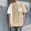 Pocket Strap Design med en känsla av nischkontrasterande färger, kvartärmad t-shirt för män på våren och sommaren, avancerad Hong Kong-stil Instagram-lapptäcke