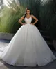 Fabuloso vestido de bola de cristal Vestido de novia para la novia Vestidos de novia de encaje con cuentas de espagueti Vestidos de novia de Qatar con volantes en el tren de barrido de Dubai