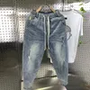 Nueva llegada pantalones Harem de mezclilla con cordón informal coreano pantalones vaqueros para hombre primavera otoño Fi Hip Hop agujeros holgados pantalones vaqueros de boda 735W #