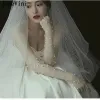 Janevini Elegant 50 cm LG bruidshandschoenen pure tule ivoren parels fingerl arm mouwen trouwhandschoenen voor bruid guantes limitos l9rf#